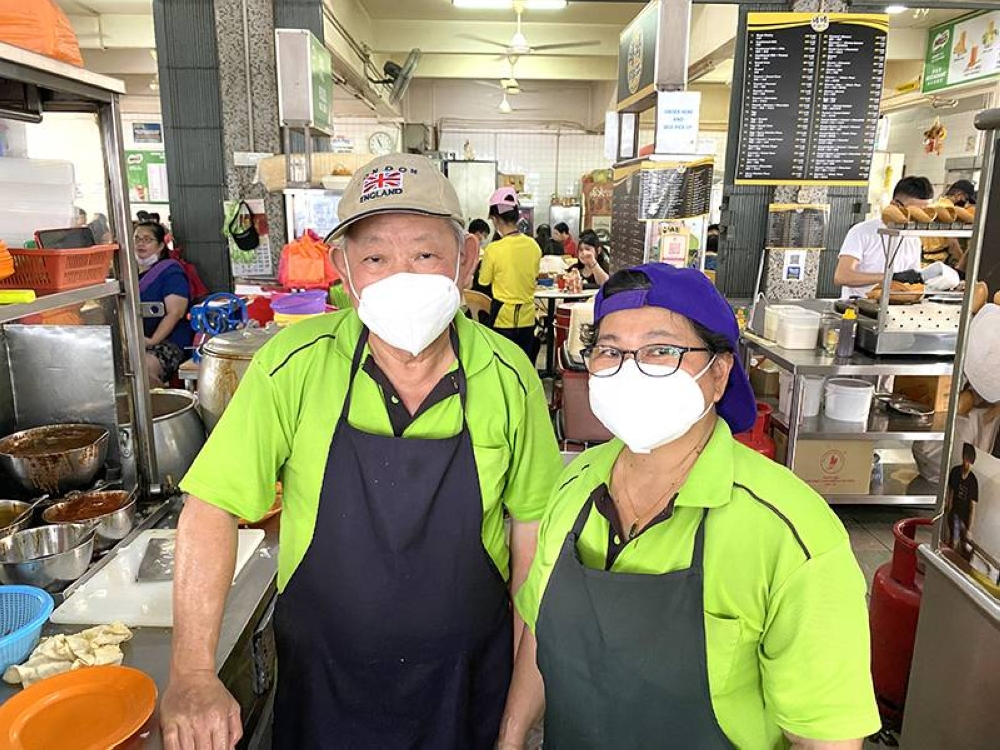 Chew Sing San (left) and his wife, Kam Ann Nee have been operating their respective stalls for 40-plus years at O&S Restaurant.