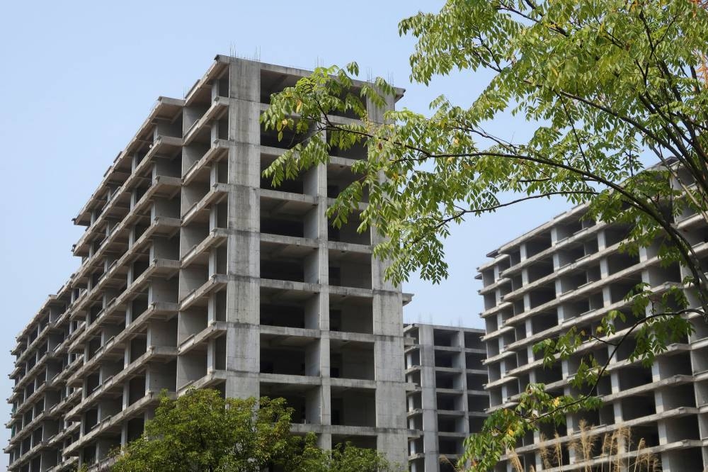 Unfinished apartment buildings stand at a residential complex developed by Jiadengbao Real Estate in Guilin, Guangxi Zhuang Autonomous Region, China September 17, 2022. — Reuters pic