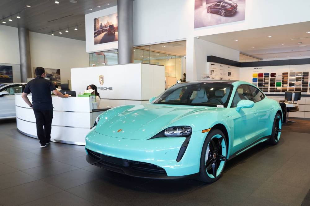 A Porsche Electric Taycan on display at Porsche Downtown LA on September 19, 2022 in Los Angeles, California. — AFP pic