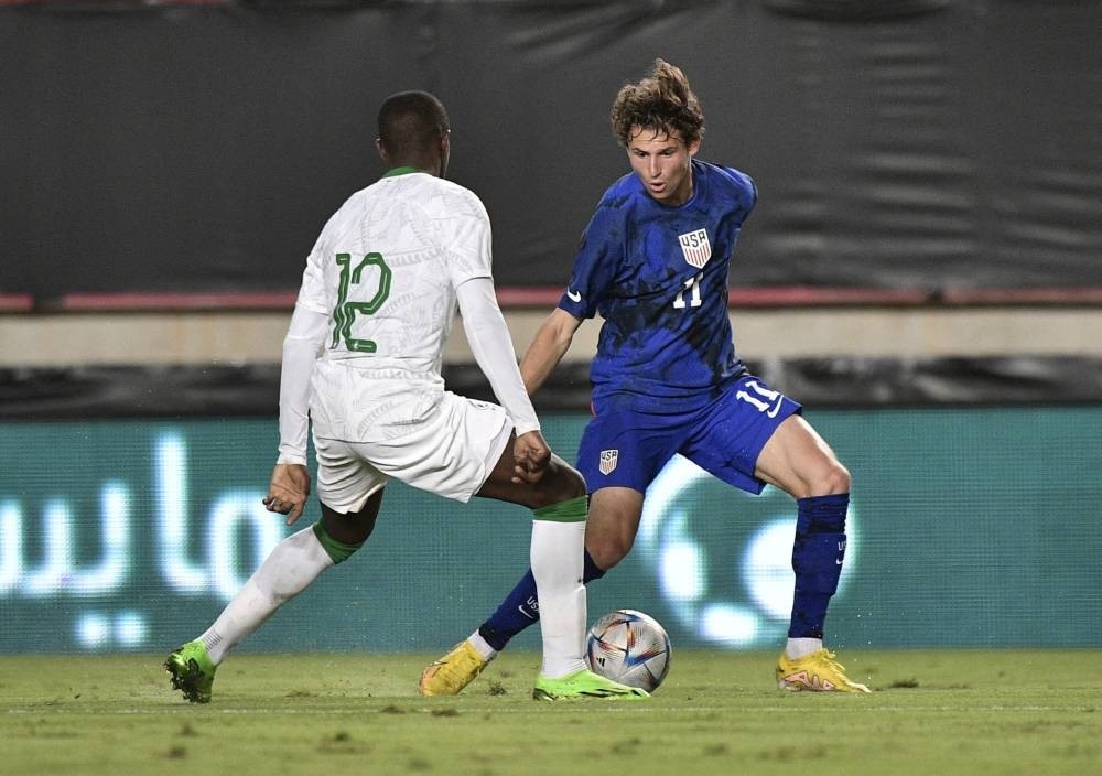 Brenden Aaronson (right) of the US in action with Saudi Arabia's Saud Abdulhamid at Estadio Nueva Condomina, Murcia September 27, 2022. — Reuters pic