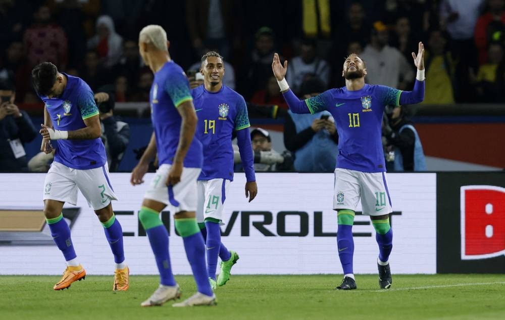Brazil's Neymar celebrates scoring their third goal against Tunisia with teammates at Parc des Princes, Paris September 27, 2022. — Reuters pic