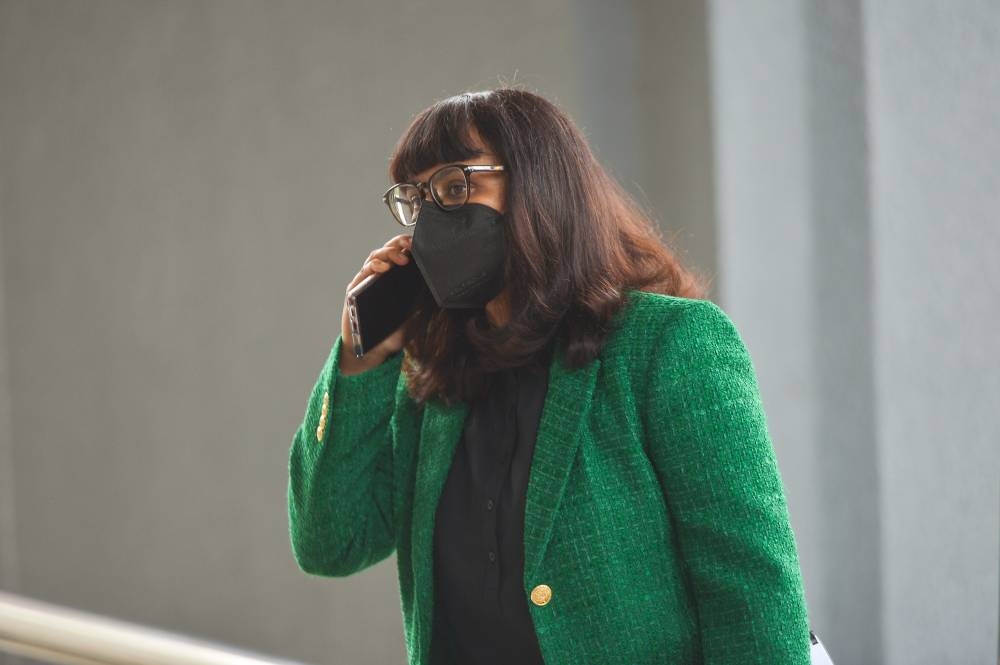 AmBank branch manager R. Uma Devi leaves the Kuala Lumpur Court Complex, September 28, 2022. — Picture by Shafwan Zaidon