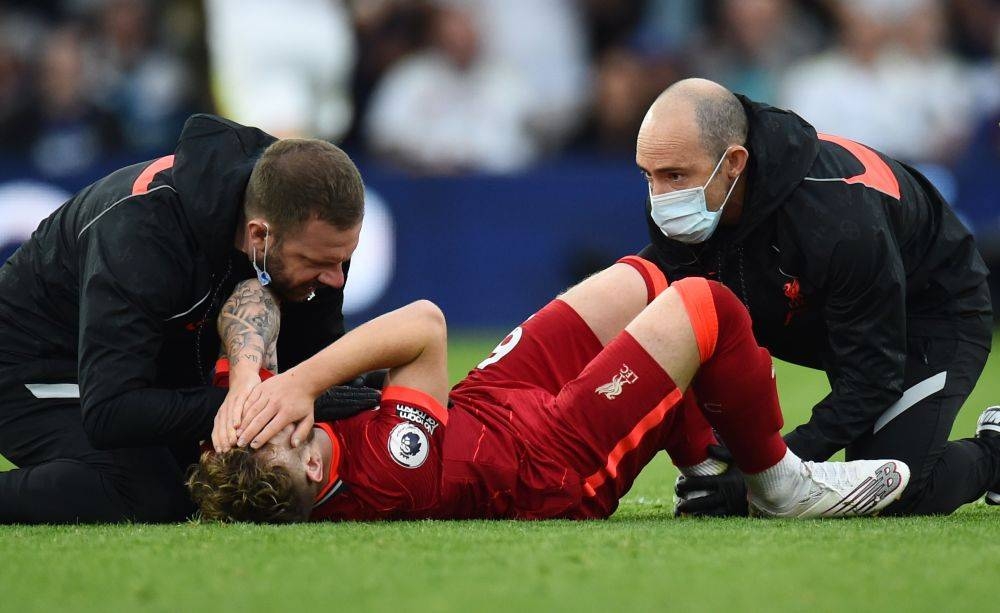 Liverpool's Harvey Elliott reacts as he receives medical attention after sustaining an injury against Leeds United at Elland Road, Leeds September 12, 2021. — Reuters pic