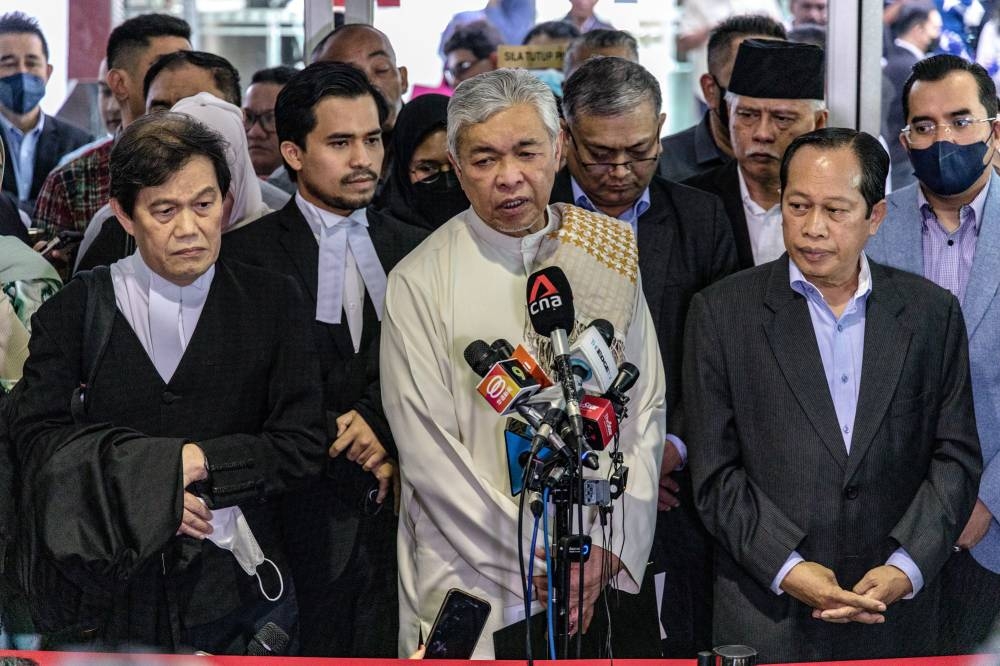 Datuk Seri Ahmad Zahid Hamidi speaks to reporters at the Shah Alam High Court Complex, in Selangor, September 23, 2022. — Picture by Firdaus Latif