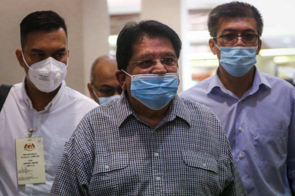 Former Federal Territories minister Datuk Seri Tengku Adnan Tengku Mansor arrives at the Kuala Lumpur Court Complex December 21, 2020. — Picture by Yusof Mat Isa