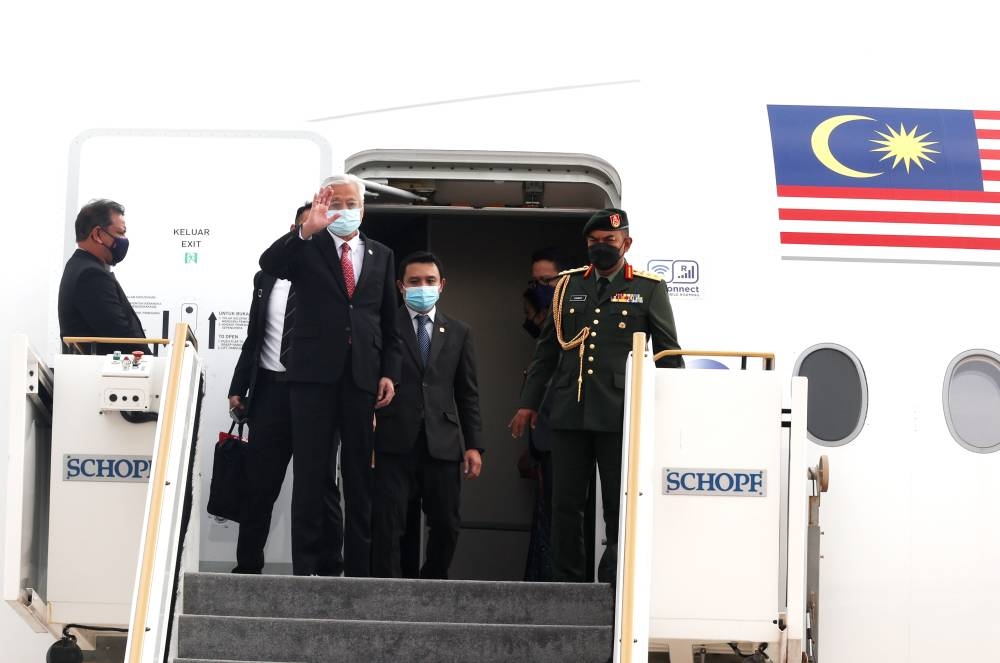 The plane carrying the prime minister and his delegation arrived at Kuala Lumpur International Airport at about 10.30pm yesterday. — Bernama pic