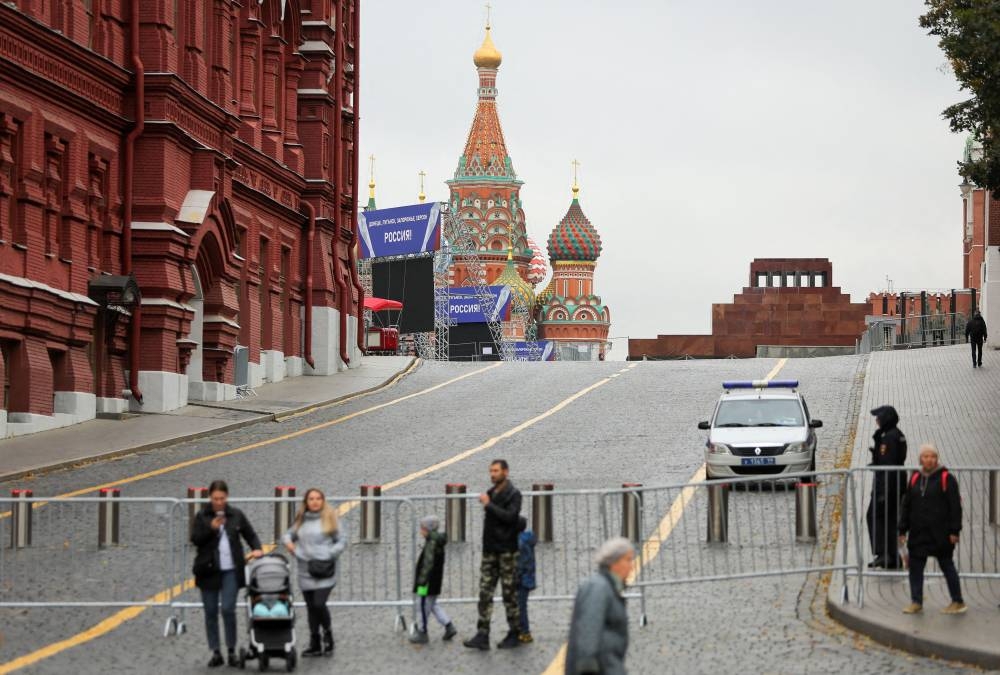 A view shows banners and constructions for a stage ahead of an expected event, dedicated to the results of referendums on the joining of four Ukrainian self-proclaimed regions to Russia, near St. Basil's Cathedral in Red Square in central Moscow, Russia September 28, 2022. ― Reuters pic