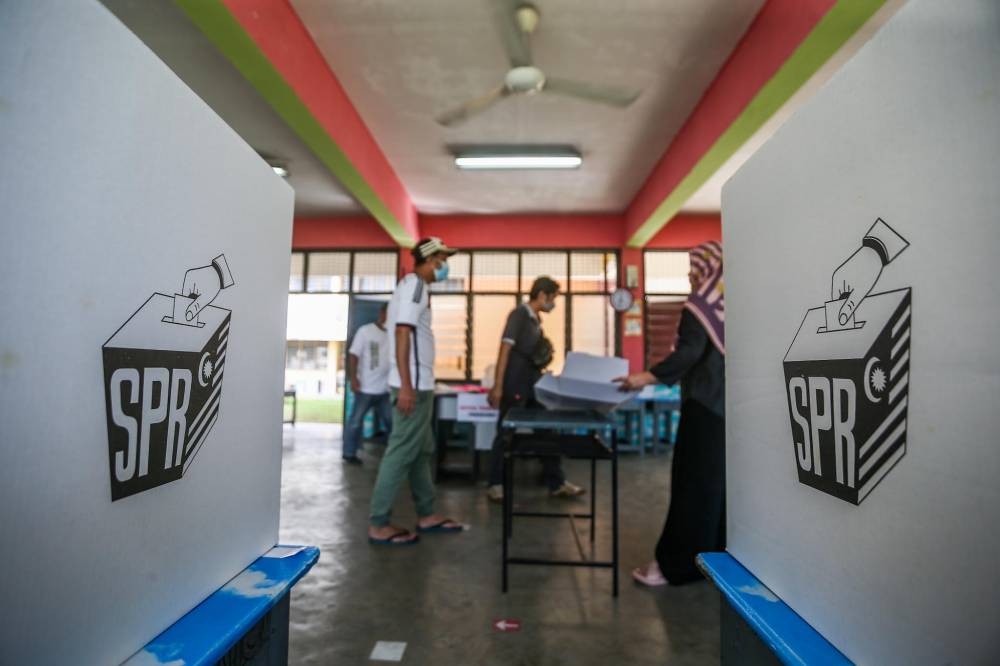 Lim criticised Umno president Datuk Seri Ahmad Zahid Hamidi for suggesting that voters should be willing to wade through flood waters to cast their ballots. — Picture by Hari Anggara