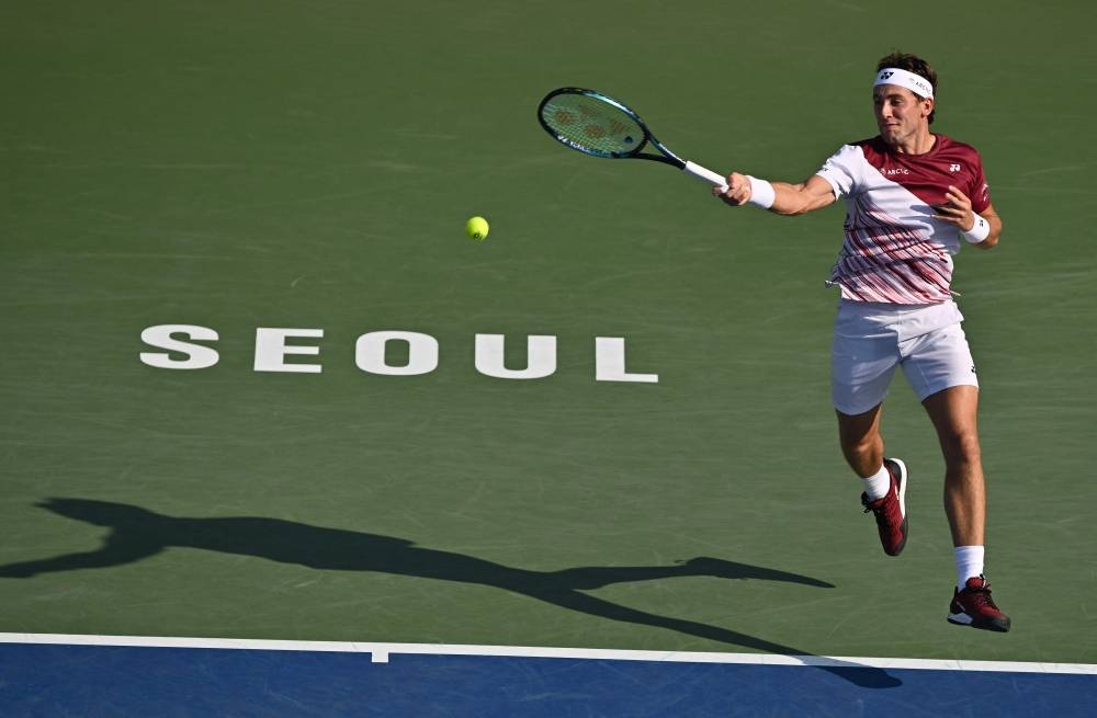Casper Ruud of Norway hits a return against Yoshihito Nishioka of Japan during their men’s singles match at the Korea Open Tennis Championships in Seoul, September 30, 2022. — AFP pic  