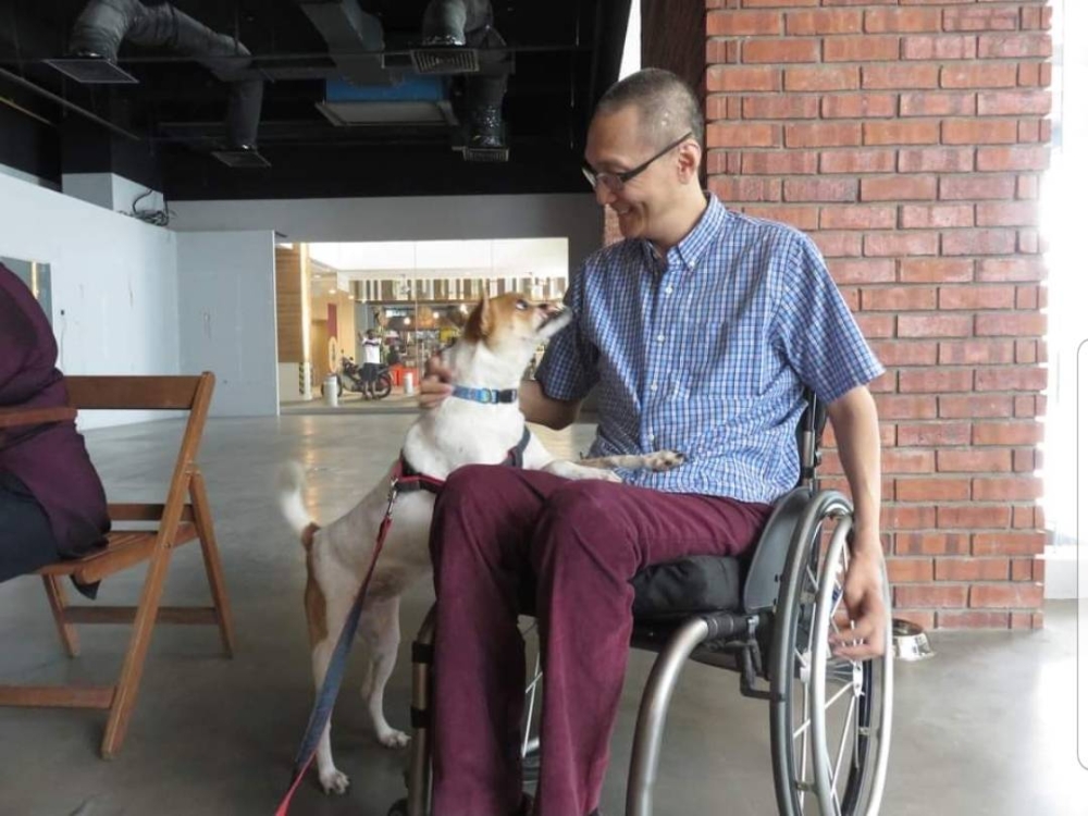 Happy shared a special bond with the late renowned disabled activist, Peter Tan. — Picture courtesy of MDDB 