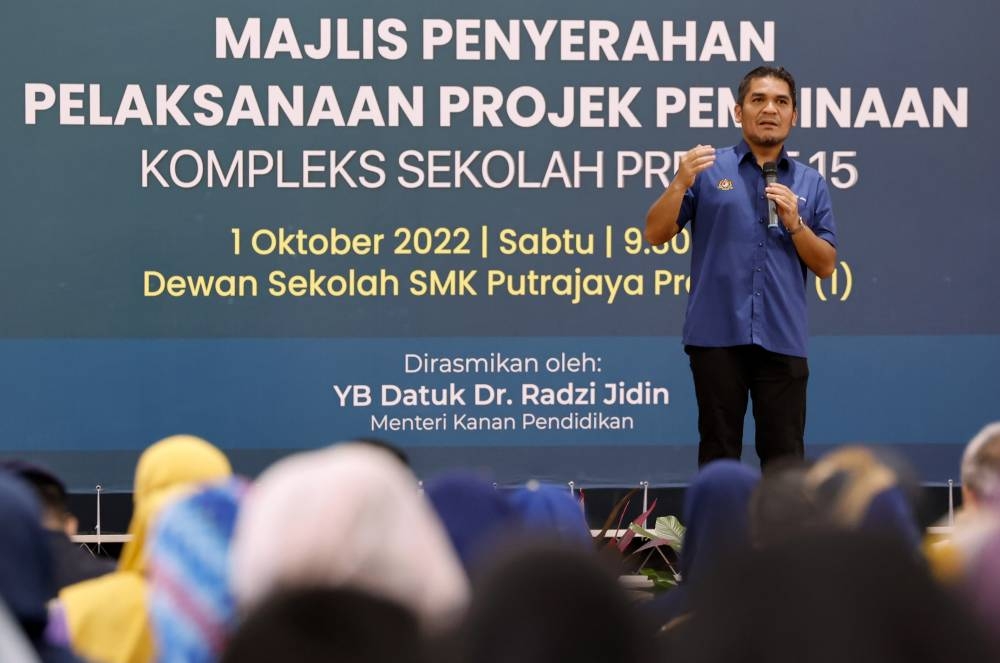 Senior Education Minister Datuk Radzi Jidin speaks during a ceremony to hand over the project implementation for construction of the Precinct 15 School Complex in Putrajaya October 1, 2022. — Bernama pic