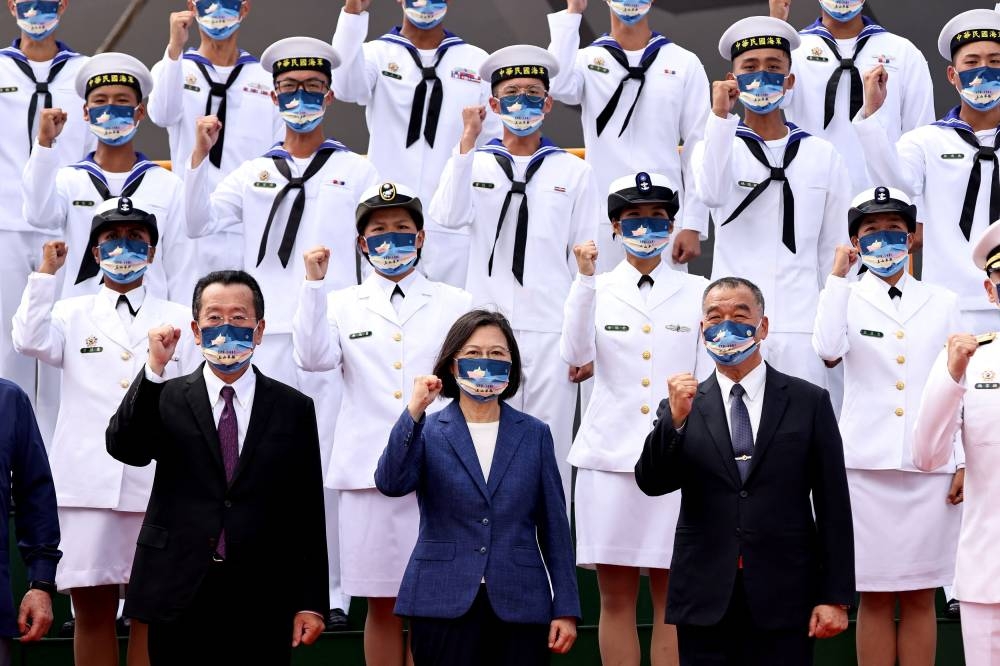 Taiwan President Tsai Ing-wen takes a group photo at a delivery ceremony for the Navy’s Yushan amphibious landing dock in Kaohsiung, Taiwan, September 30, 2022. ― Reuters pic