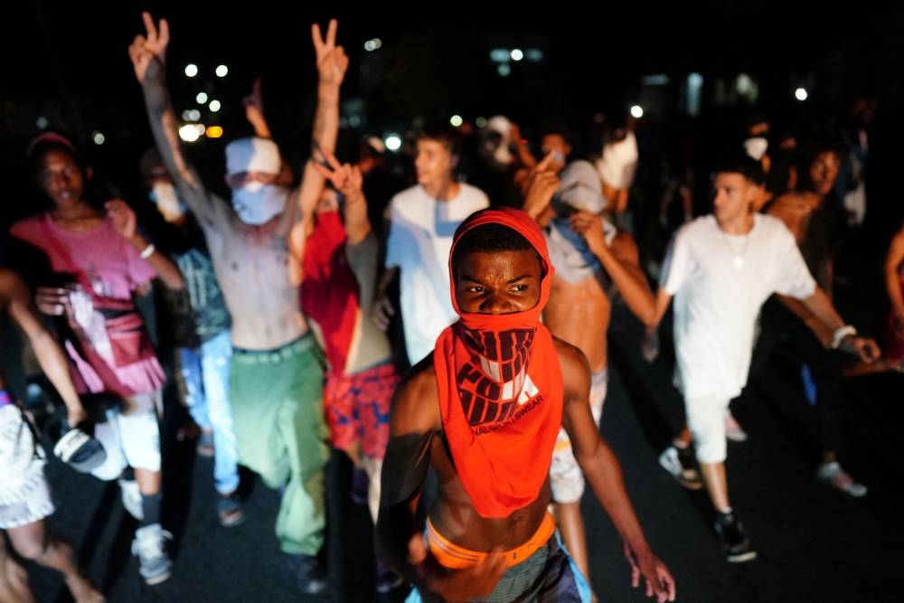 People shout slogans in a protest during a blackout in the aftermath of Hurricane Ian in Havana, Cuba, September 30, 2022. ― Reuters pic