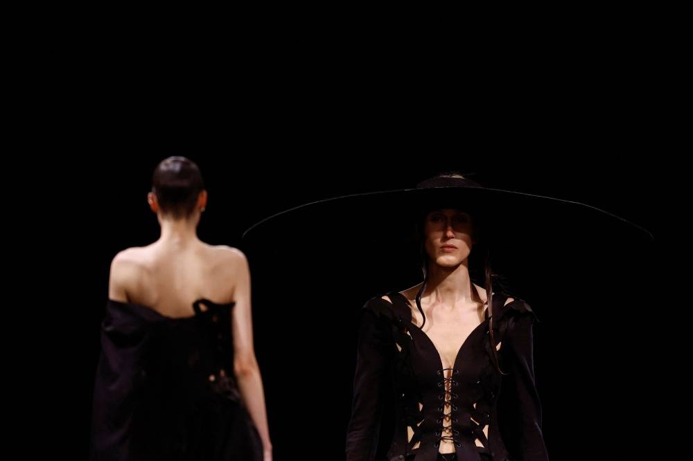 Models present creations by designer Yohji Yamamoto as part of his Spring-Summer 2023 Women's ready-to-wear collection show during Paris Fashion Week, France September 30, 2022. ― Reuters pic