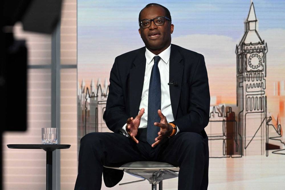 A handout picture released by the BBC, taken and received on September 25, 2022, shows Britain's Chancellor of the Exchequer Kwasi Kwarteng during an appearance on the BBC’s ‘Sunday Morning’ political television show with journalist Laura Kuenssberg. ― AFP pic