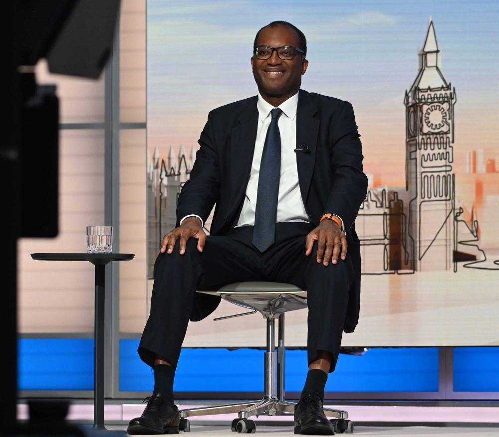 A handout picture released by the BBC, taken and received on September 25, 2022, shows Britain's Chancellor of the Exchequer Kwasi Kwarteng during an appearance on the BBC’s ‘Sunday Morning’ political television show with journalist Laura Kuenssberg. ― AFP pic