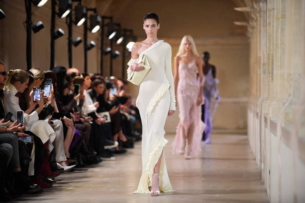 A model presents a creation for the Victoria Beckham Spring-Summer 2023 fashion show during the Paris Womenswear Fashion Week, in Paris, on September 30, 2022. ― AFP pic