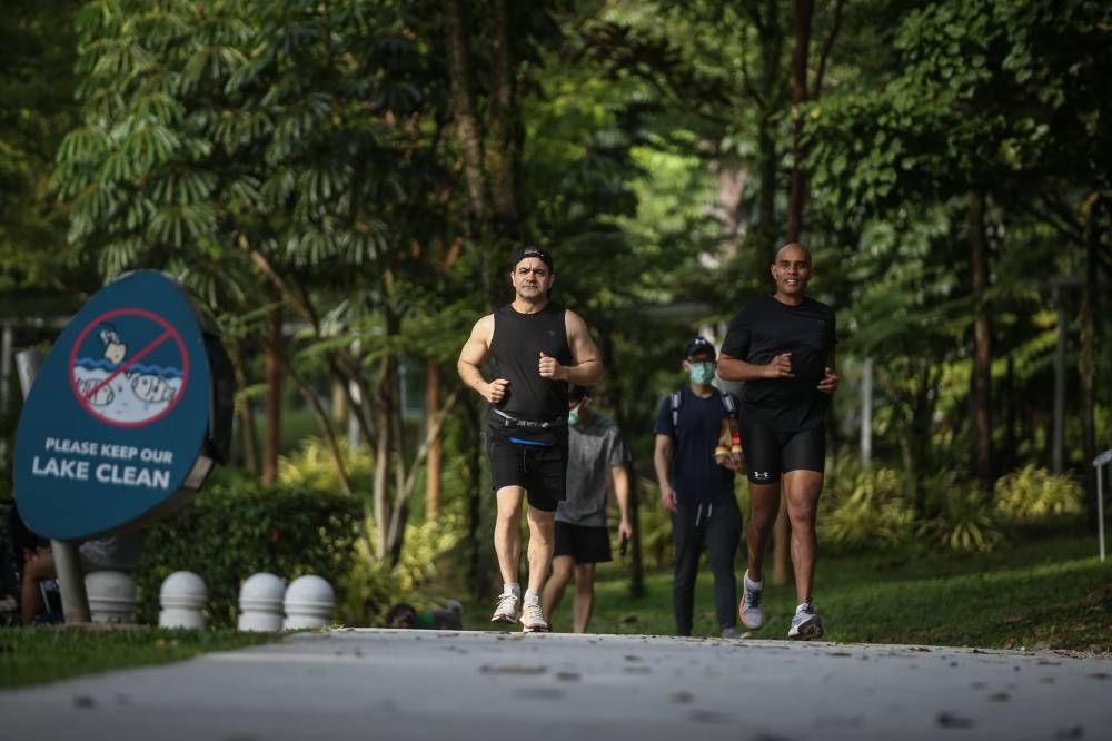Shirkouhi (left) and his running partner Siva (right) during Shirkouhi's fifth annual birthday run on August 21 at The Central Park in Desa Park City. — Picture by Ahmad Zamzahuri
