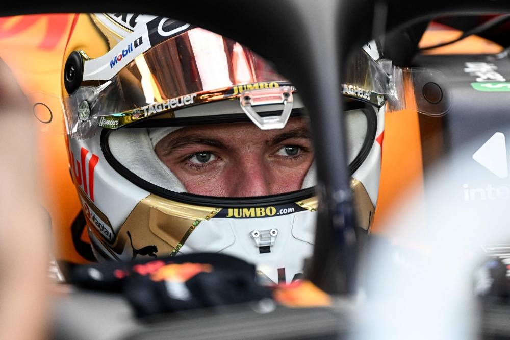 Red Bull Racing's Dutch driver Max Verstappen is pictured in his car before the first practice session ahead of the Formula One Singapore Grand Prix night race at the Marina Bay Street Circuit in Singapore on September 30, 2022. — AFP pic