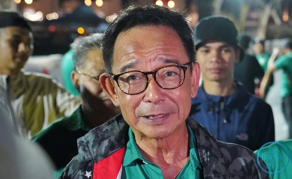 Abdul Karim speaks to the press after flagging off the 42-kilometre category of the Kuching Marathon 2022 at Padang Merdeka in Kuching this morning. — Photo by Chimon Upon/Borneo Post