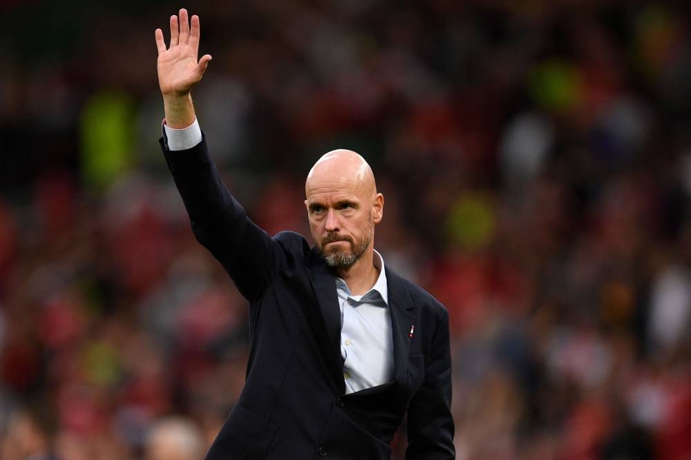 Manchester United manager Erik ten Hag gestures to supporters as he leaves after the English Premier League football match between Manchester United and Arsenal at Old Trafford in Manchester September 4, 2022.— AFP pic