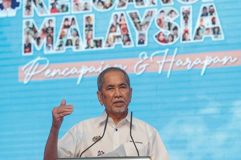 Minister in Prime Minister Department (Parliament and Laws) Datuk Seri Wan Junaidi Tuanku Jaafar delivering his speech during the Keluarga Malaysia Symposium here at Putrajaya International Convention Centre on  August 21, 2022. — Picture by Sayuti Zainudin