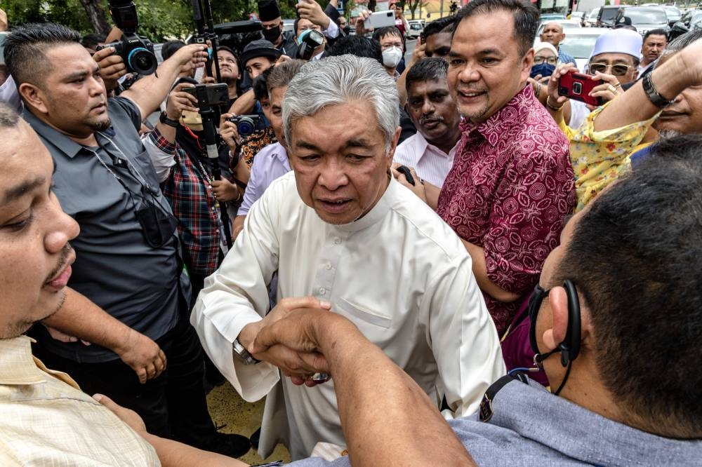 Datuk Seri Ahmad Zahid Hamidi with his supporters after court the decision the Shah Alam High Court Complex, in Selangor on September 23, 2022. Picture by Firdaus Latif  