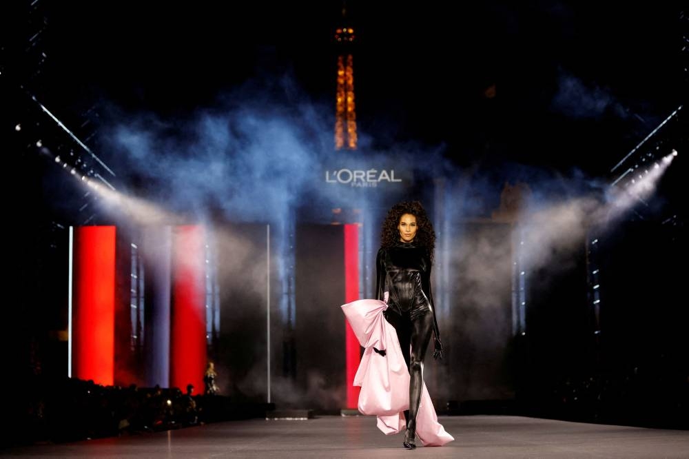 Model Cindy Bruna presents a creation during a public show organised by French cosmetics group L'Oreal as part of Paris Fashion Week, in Paris, France October 2, 2022. — Reuters pic