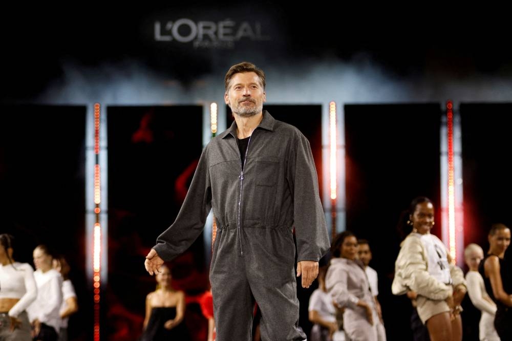Actor Nikolaj Coster-Waldau presents a creation during a public show organised by French cosmetics group L'Oreal as part of Paris Fashion Week, in Paris, France October 2, 2022. — Reuters pic