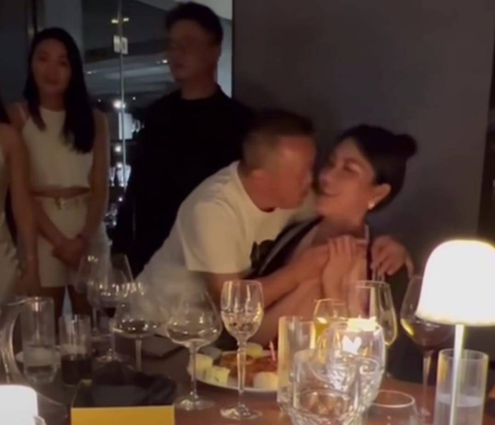 Hong Kong celebrity Eric Tsang said it was only 'polite' to kiss a model whom he did not know during her birthday do. — Instagram screencap/ lebara_balabala
