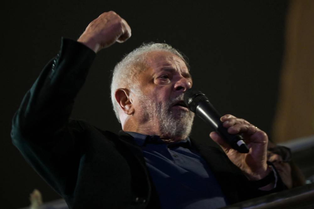 Brazilian former President (2003-2010) and candidate for the leftist Workers Party (PT) Luiz Inacio Lula da Silva speaks to supporters after learning the results of the legislative and presidential election at Paulista avenue in Sao Paulo, Brazil, on October 2, 2022. — AFP pic
