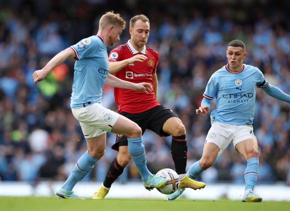 Manchester City's Kevin De Bruyne in action with Manchester United's Christian Eriksen at the Etihad Stadium, Manchester October 2, 2022. — Reuters pic