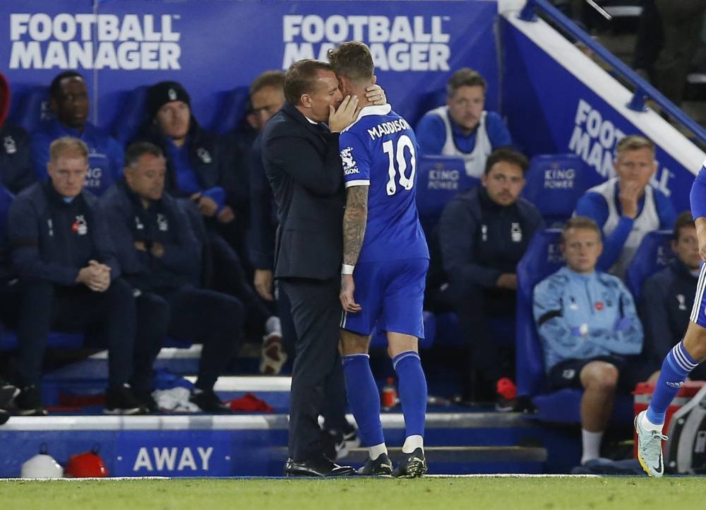 Leicester City manager Brendan Rodgers embraces James Maddison after the latter's substitution against Nottingham Forest at the King Power Stadium, Leicester October 3, 2022. — Reuters pic 