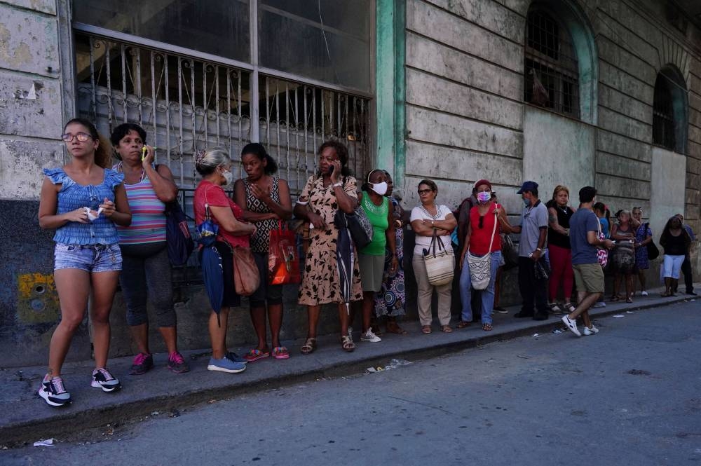People wait in line to enter a store in downtown Havana October 3, 2022. — Reuters pic