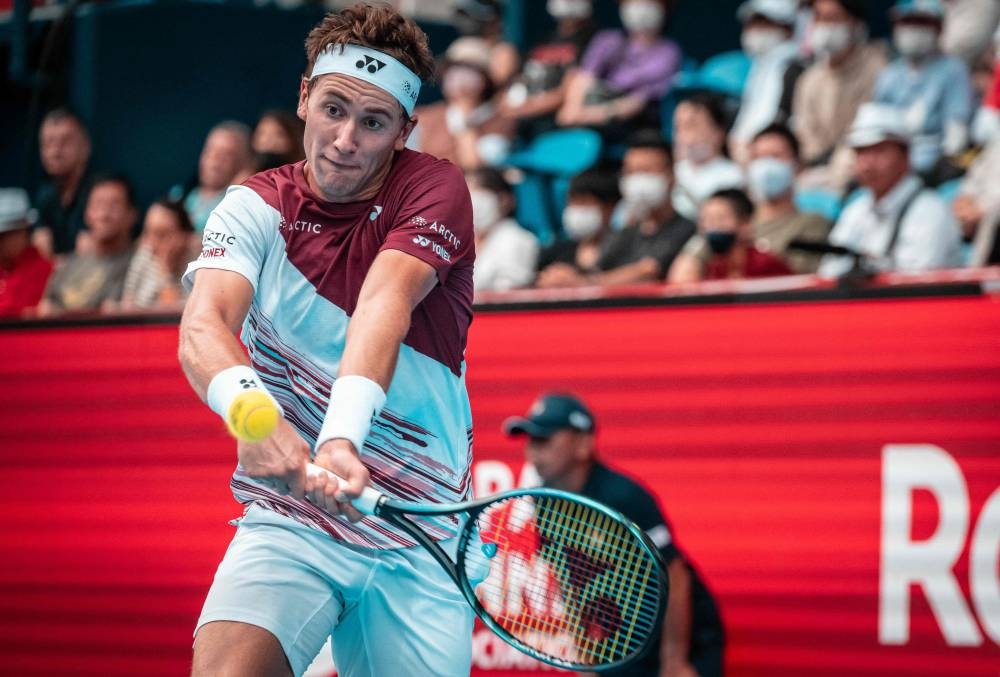 Casper Ruud of Norway hits a return against Jaume Munar of Spain during their men’s singles match at the Japan Open tennis tournament in Tokyo, October 4, 2022. — AFP pic 