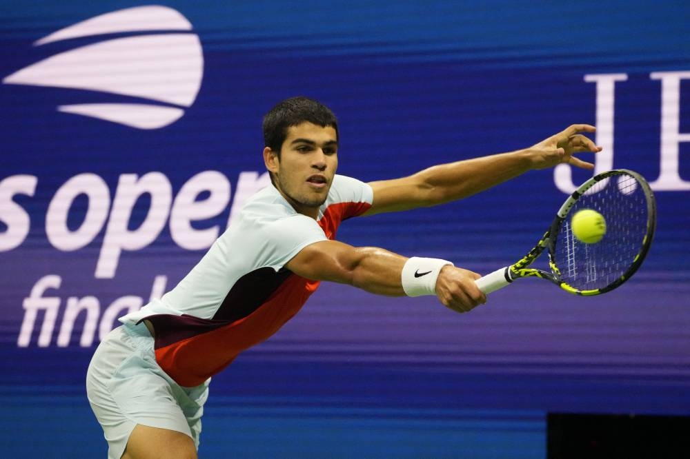 Carlos Alcaraz reaches for a backhand against Casper Ruud in the men’s singles final at the USTA Billie Jean King Tennis Center, September 11, 2022. — Reuters pic