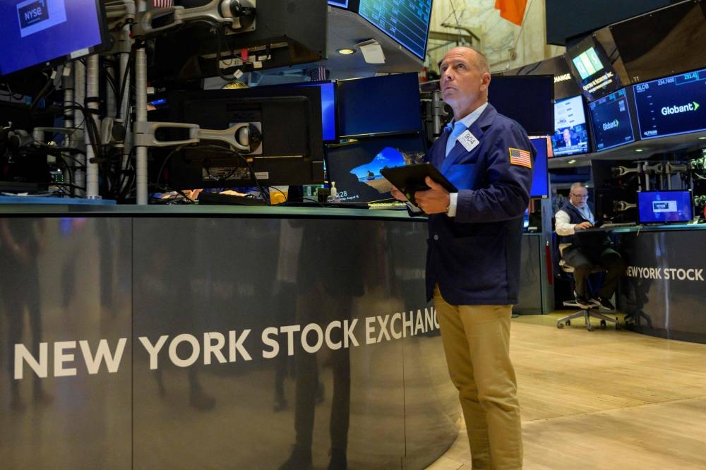 The Dow Jones Industrial Average rose 825.43 points, or 2.8 per cent, to 30,316.32, the S&P 500 gained 112.5 points, or 3.06 per cent, at 3,790.93 and the Nasdaq Composite added 360.97 points, or 3.34 per cent, at 11,176.41. — AFP pic