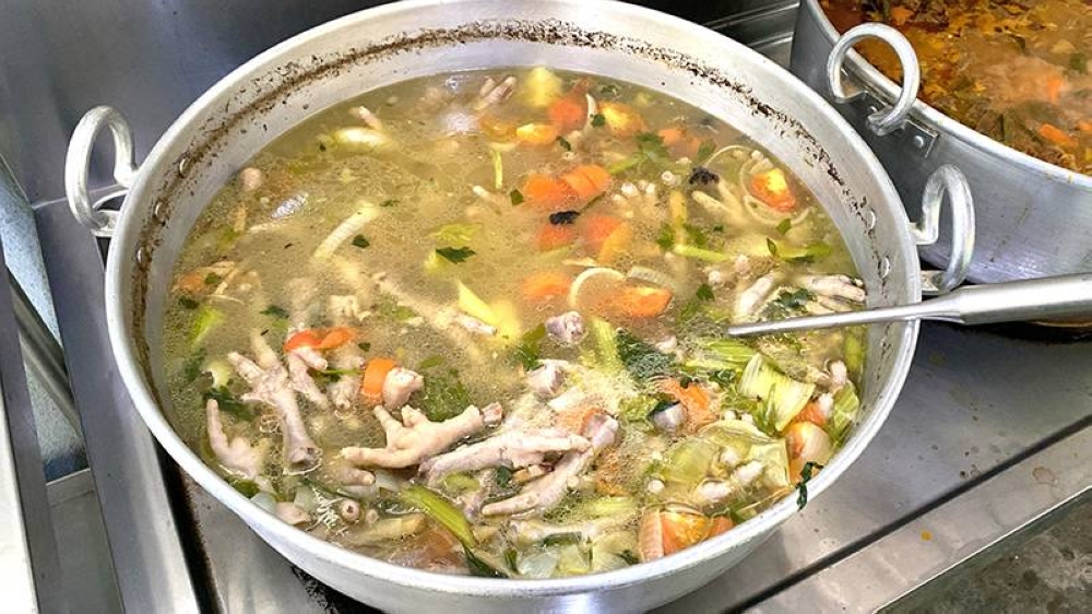 Everyone's favourite is this chicken feet soup with vegetables that you scoop yourself from the pot.