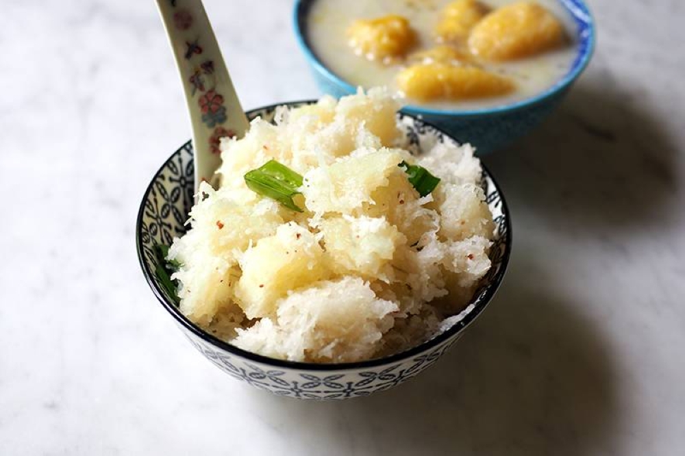 They offer this unusual, tasty steamed tapioca cubed and tossed with grated coconut, sugar and a dash of salt.