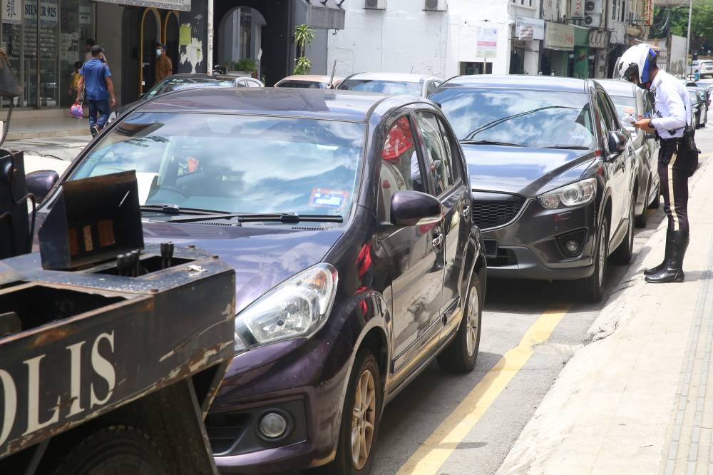 Royal Malaysia Police secretary Datuk Noorsiah Saaduddin said most of the summonses were issued on motorcycles at 8,211, followed by cars (6,083), lorries (528), vans (264), buses (22) and other vehicles (1,055). — Picture by Choo Choy May