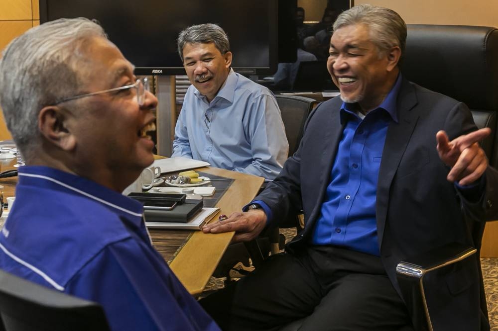 BN chairman Datuk Seri Ahmad Zahid Hamidi together with BN deputy chairman Datuk Seri Mohamad Hasan and Prime Minister Datuk Seri Ismail Sabri Yaakob are pictured at an Umno and BN supreme council meeting in Menara Dato Onn World Trade Centre Kuala Lumpur, August 15, 2022. — Picture by Hari Anggara