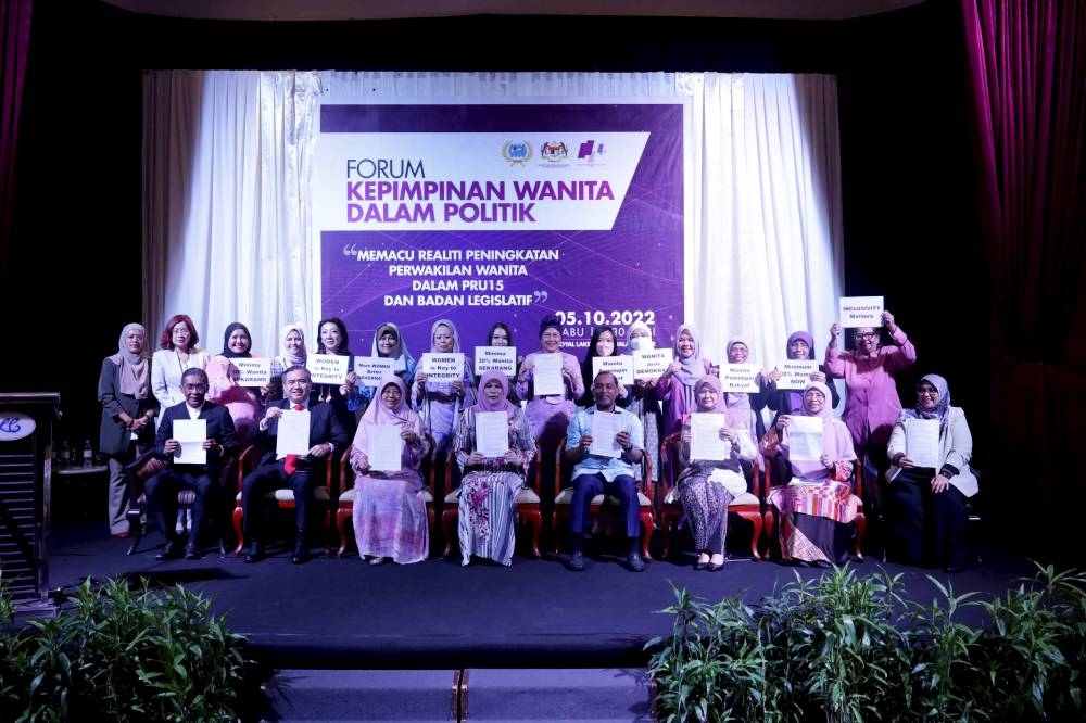 Women, Family and Community Development Minister Datuk Seri Rina Mohd Harun (seated, 4th left) with forum participants at the Royal Lake Club banquet hall, Taman Tasik Perdana, October 5, 2022. — Bernama pic 