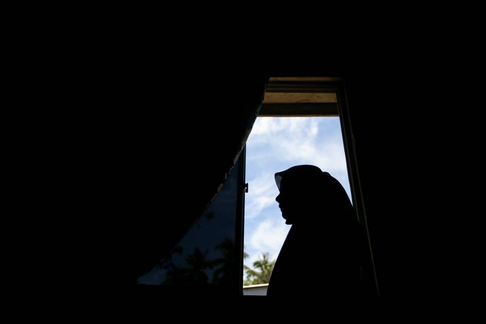 Siti who was shocked after finding out about her HIV-status was comforted by doctors that she would feel better if she took her medications. — Picture via Ahmad Zamzahuri