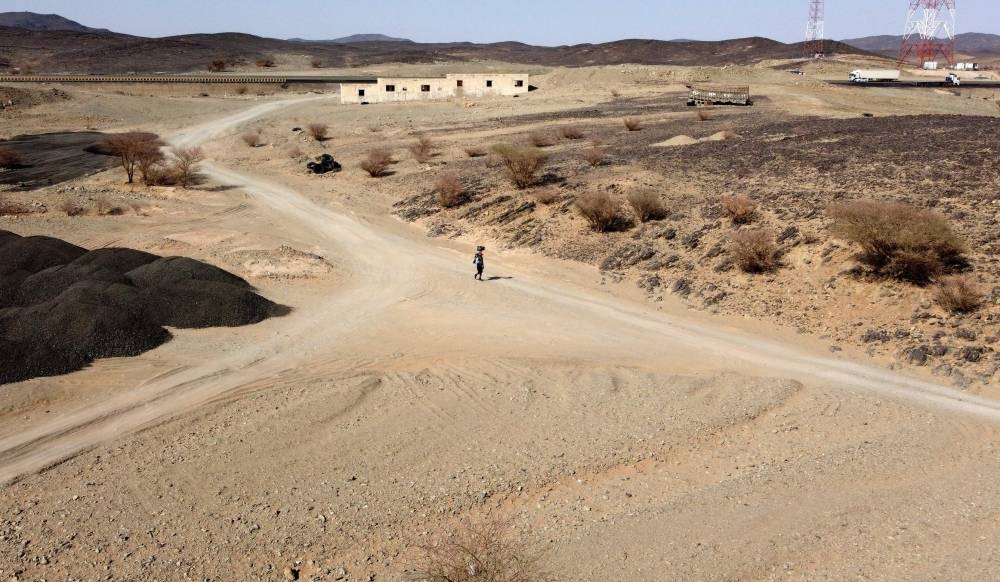 Alsulmi crosses a desert area near al-Khasrah area. — AFP pic