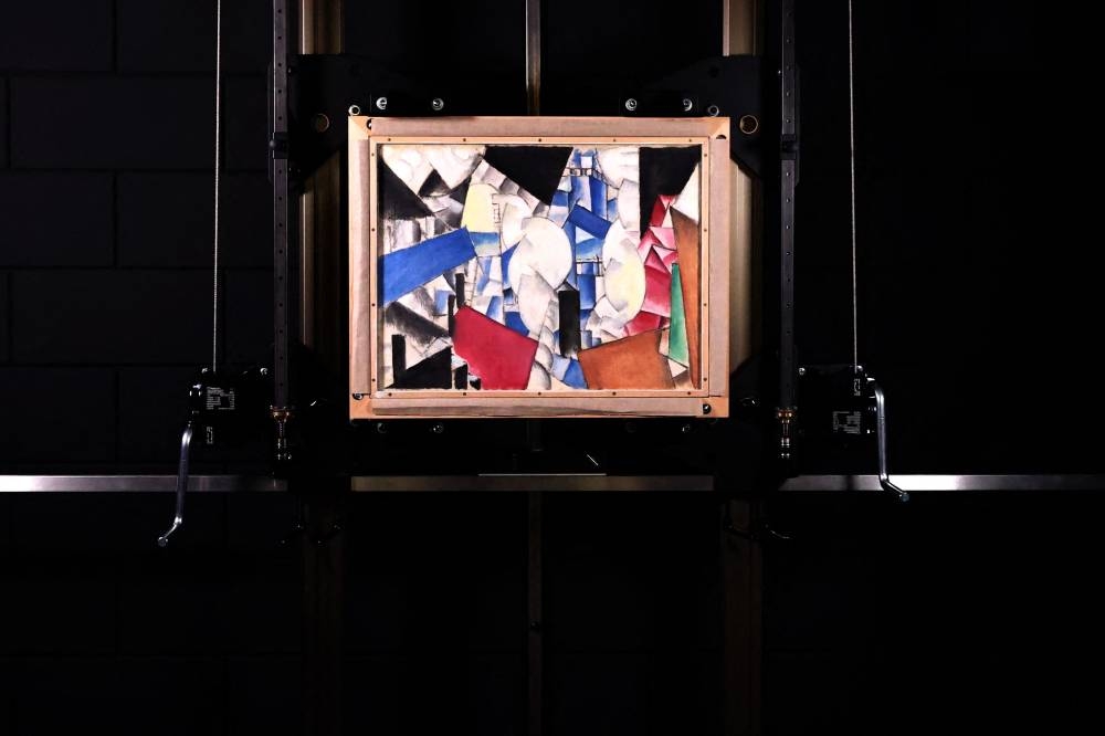 This photograph taken in The Hague on October 4, 2022 shows Fernand Leger's painting 