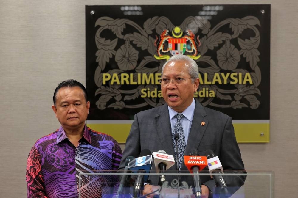 Communications and Multimedia minister Tan Sri Annuar Musa speaks to the media at Parliament building, October 6, 2022. — Bernama pic 