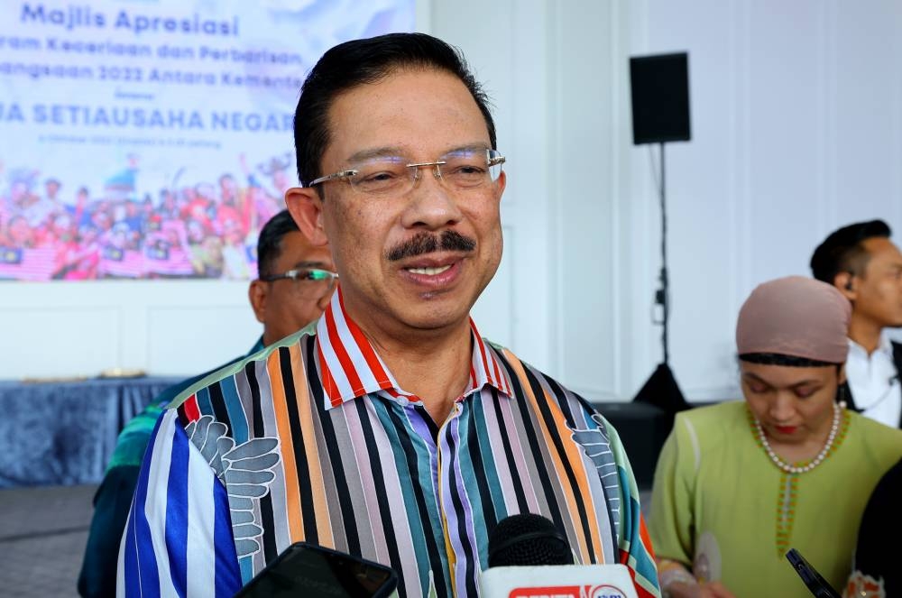 Chief Secretary to the Government Tan Sri Mohd Zuki Ali speaks during the appreciation ceremony of the inter-department parade and programme to enliven the National Day 2022 celebration in Putrajaya October 6, 2022. — Bernama pic