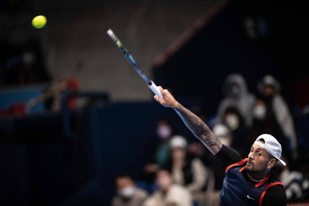 Nick Kyrgios of Australia serves a ball to Kamil Majchrzak of Poland during their men’s singles match at the Japan Open tennis tournament in Tokyo, October 6, 2022. — AFP pic 