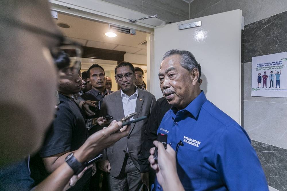 Tan Sri Muhyiddin Yassin speaks to the media at the Perikatan Nasional headquarters in Kuala Lumpur on October 6, 2022. — Picture by Hari Anggara
