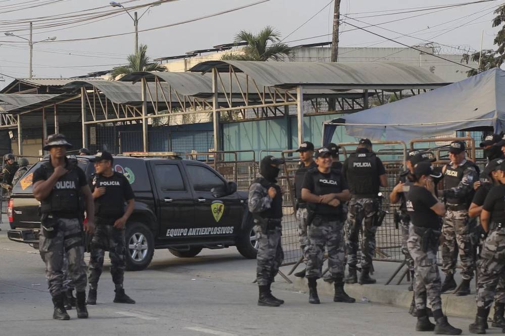 Police stand guard outside the Guayas 1 prison complex in Guayaquil, Ecuador on October 5, 2022. — AFP pic